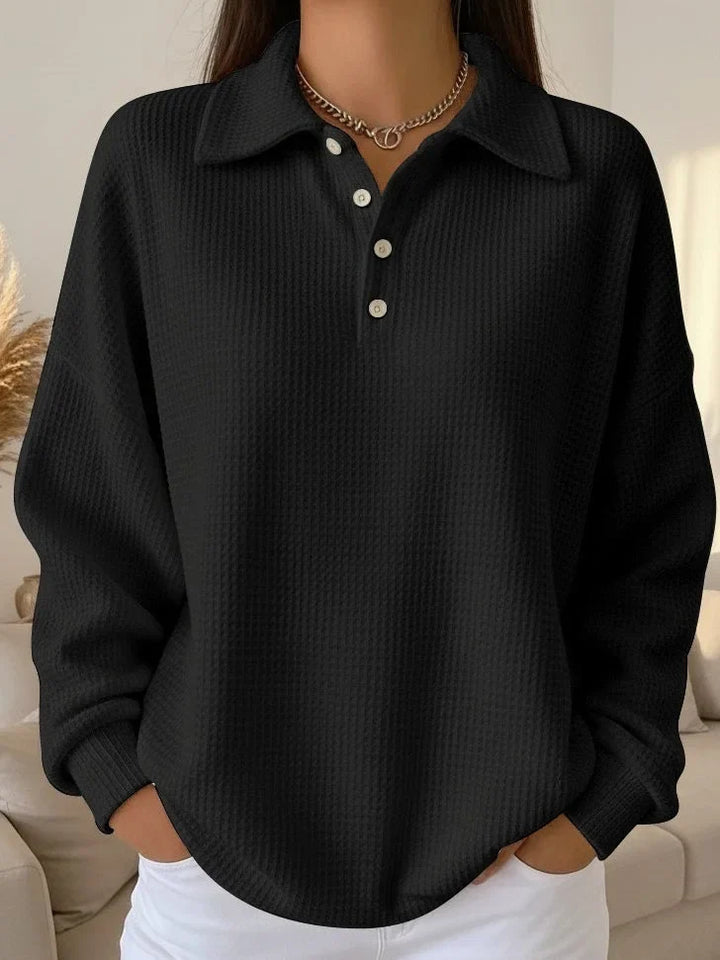 Women's fashion textured polo sweater with long sleeves & classic button details. A versatile ladies' top.