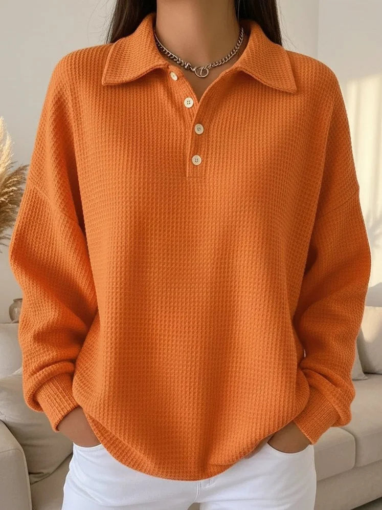 Elegant women's long sleeve polo sweater featuring a chic button-up placket & unique textured knit design.