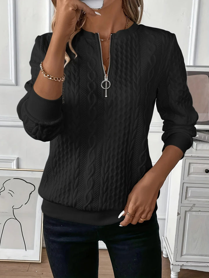 Women's elegant textured knit quarter-zip sweater, long sleeve. A cozy top for winter layered looks.