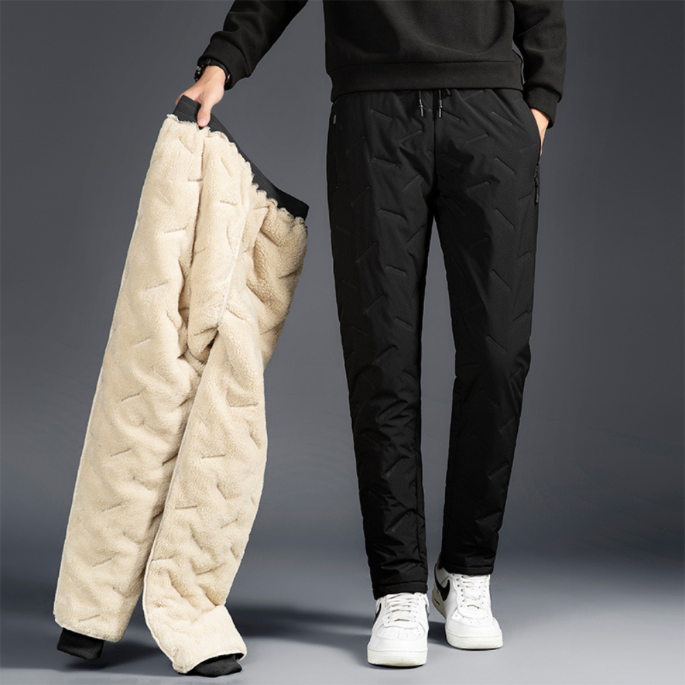 Women's thermal waterproof fleece-lined trousers, black, fleece interior, zippered pockets, ideal winter outdoor wear.