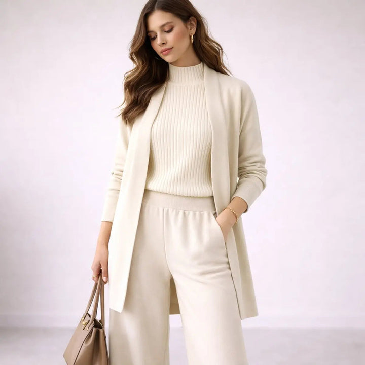 Women's relaxed three-piece lounge set: longline cardigan, cami, and wide-leg pants for comfortable everyday wear.
