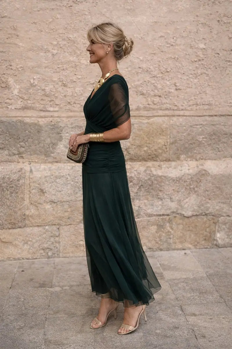 Elegant long V-neck maxi dress with ruched waist, ideal for wedding guests & evening events.