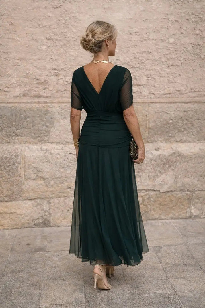 Plus size V-neck ruched maxi dress for women, suitable for cocktail parties & formal occasions.
