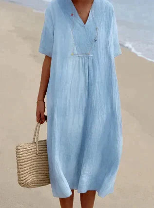 Women's V-Neck Relaxed Midi Dress in light, breathable fabric, featuring a flattering silhouette and perfect for warm weather