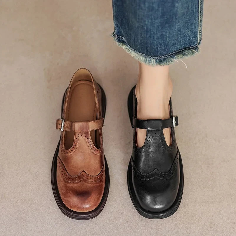 Stylish women's Mary Jane sandals, flat design with elegant brogue details & adjustable buckle.