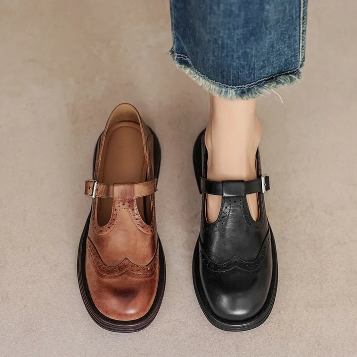 Stylish women's Mary Jane sandals, flat design with elegant brogue details & adjustable buckle.