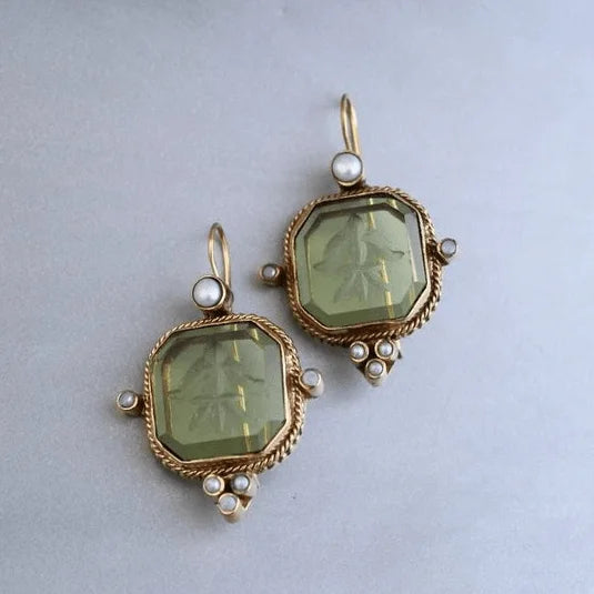 Vintage gold-tone octagonal dangle earrings for women with carved green stone. Elegant statement jewelry, gift for her.
