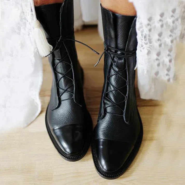 Women's vintage lace-up mid-calf boots with a stylish cap-toe. Elegant and comfortable for fall fashion.