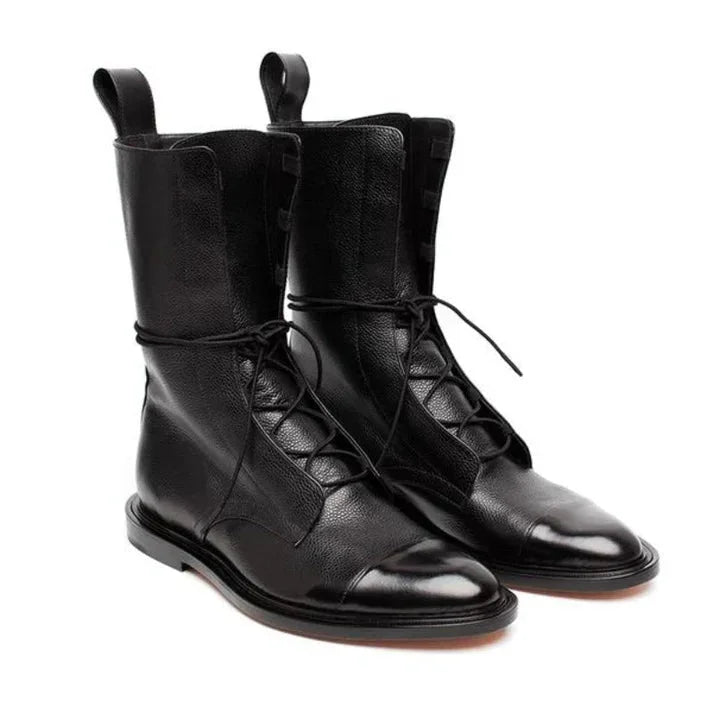 Stylish women's vintage-inspired mid-calf boots with lace-up detail & cap-toe. Ideal for fall/winter.