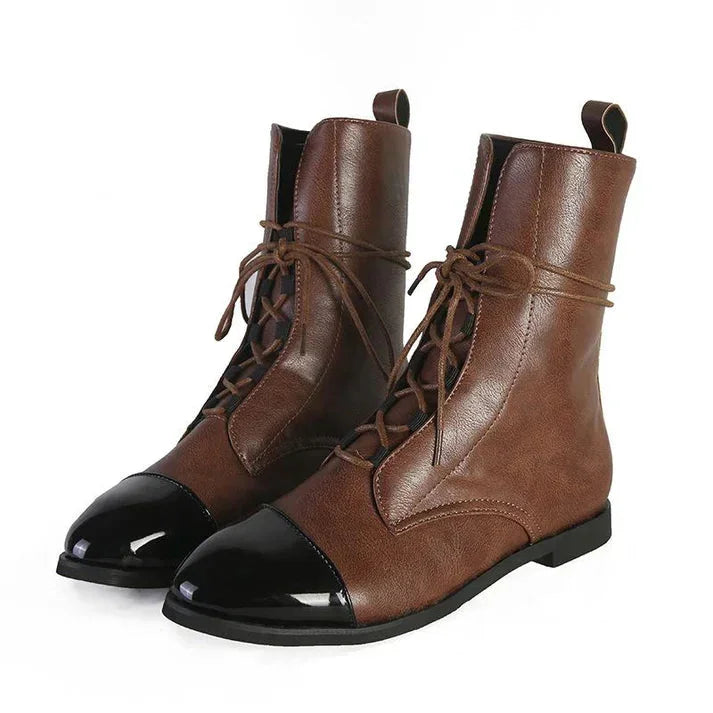 Elegant women's mid-calf lace-up boots featuring a classic cap-toe, perfect for versatile vintage style.