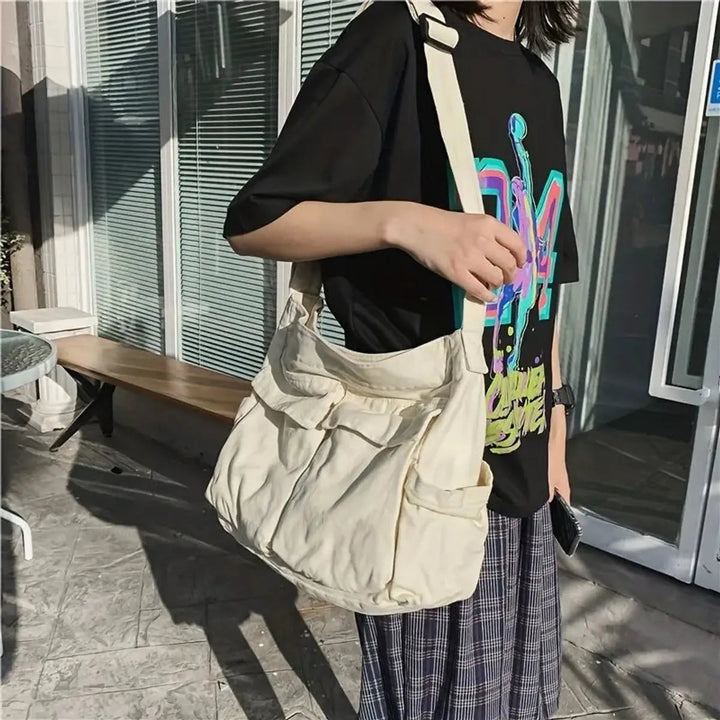 Practical women's vintage canvas multi-pocket bag for daily essentials, doubles as tote or crossbody.