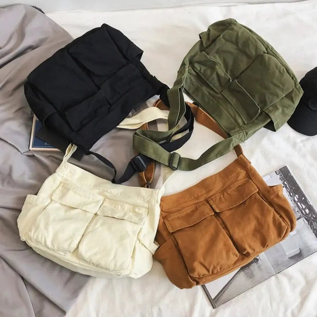 Chic women's vintage canvas crossbody bag with multiple compartments, great for casual outings.