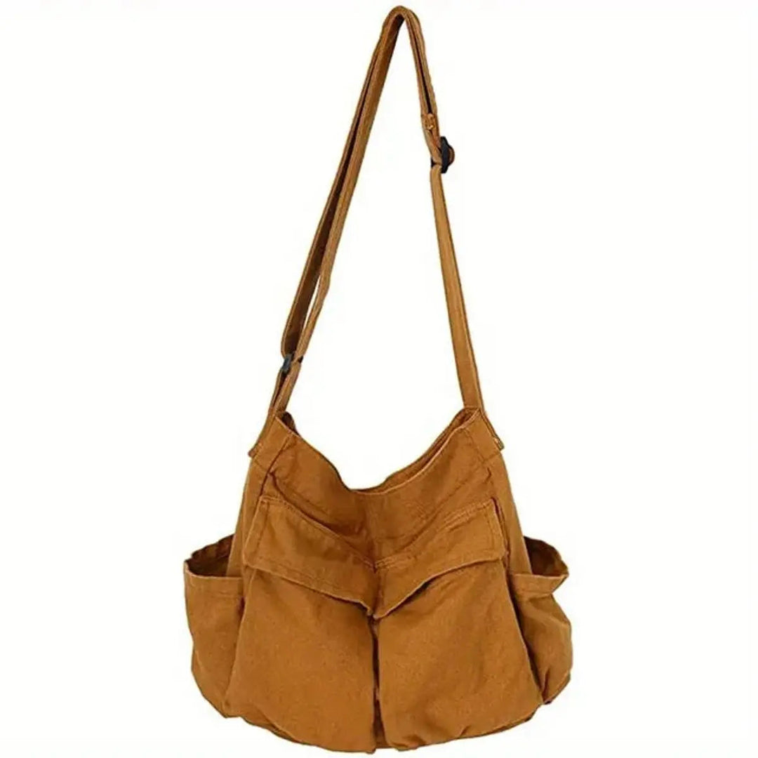 Spacious women's vintage canvas multi-pocket tote bag, keeps essentials organized and accessible.