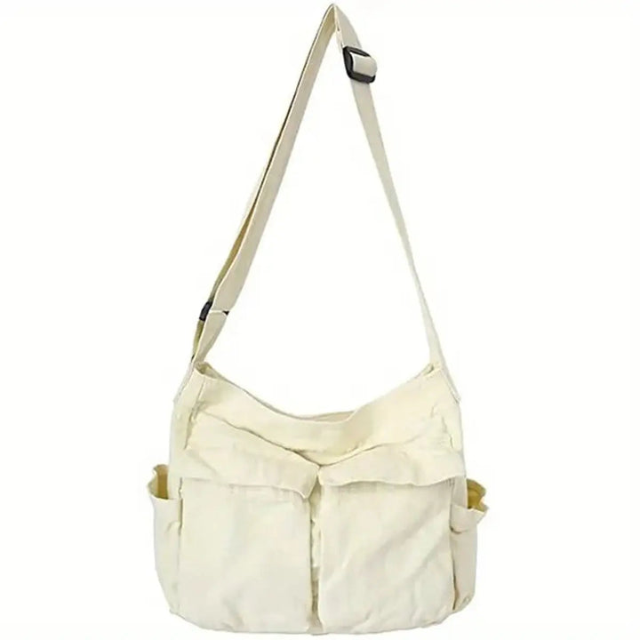 Durable women's vintage canvas tote bag with multi-pockets, easily converts to a crossbody.