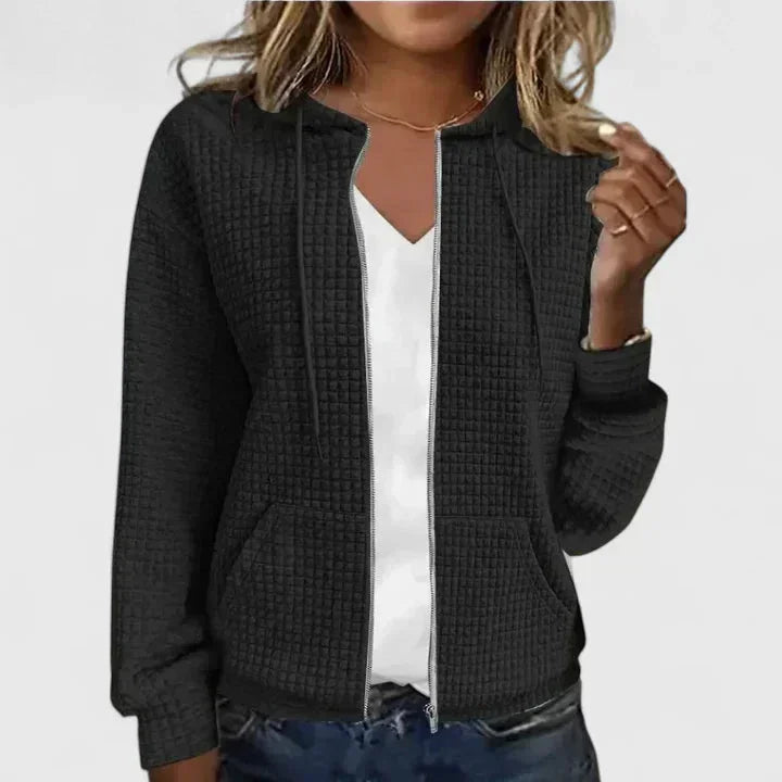 Cozy women's full-zip waffle-knit hooded cardigan with pockets, perfect for comfortable layering.