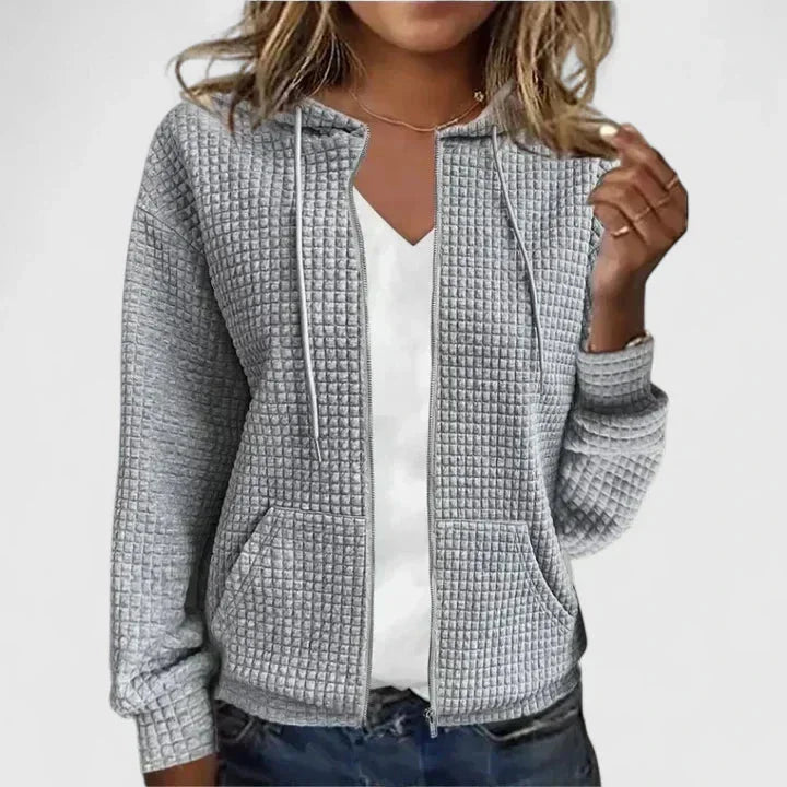 Soft waffle-knit women's full-zip hooded cardigan. Comfortable sweater with convenient side pockets.