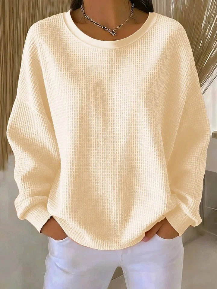 Soft women's relaxed fit waffle knit sweater, long sleeves, perfect for layering.