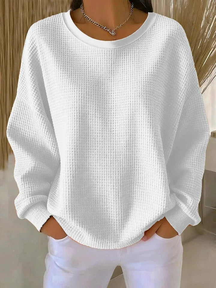 Women's cozy waffle knit pullover sweater, long sleeves, ideal for casual wear.
