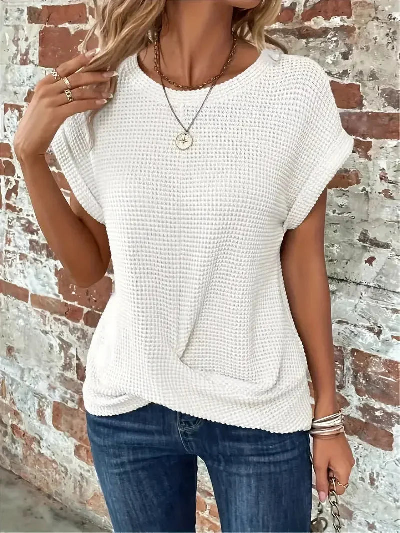 Women's waffle knit short sleeve top with stylish front twist, perfect for casual everyday wear.