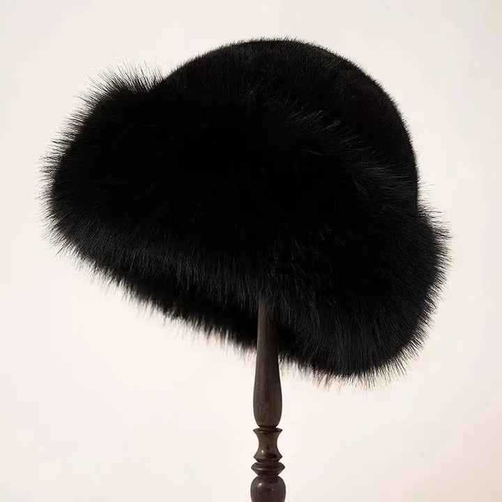 Luxurious women's faux fur winter hat, warm & fluffy with a wide cuffed brim, ideal for cold weather.