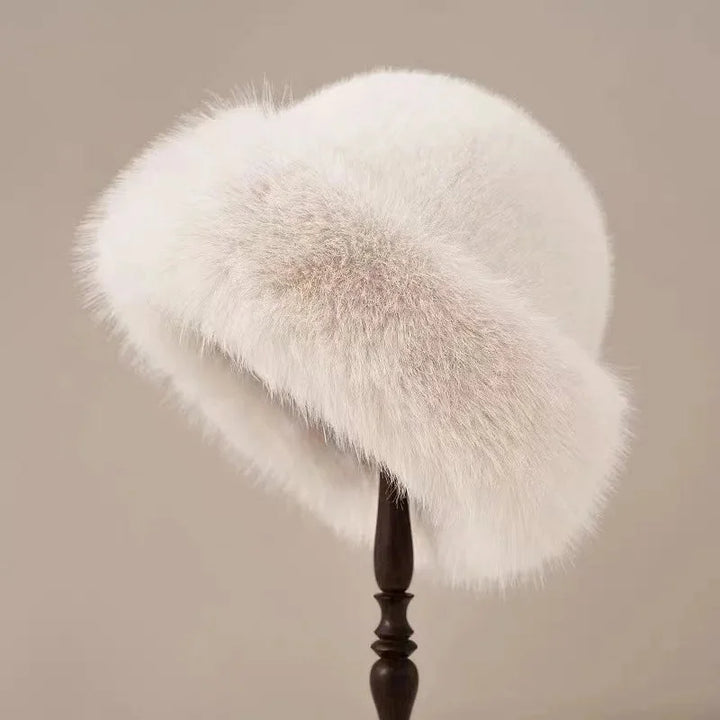 Fluffy faux fur winter hat for women, featuring a wide cuffed brim for extra warmth & style.