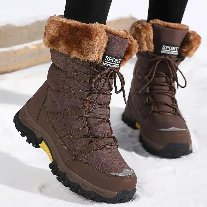 Lace-up women's waterproof winter boots; warm, stylish quilted design for snow and outdoor adventures.