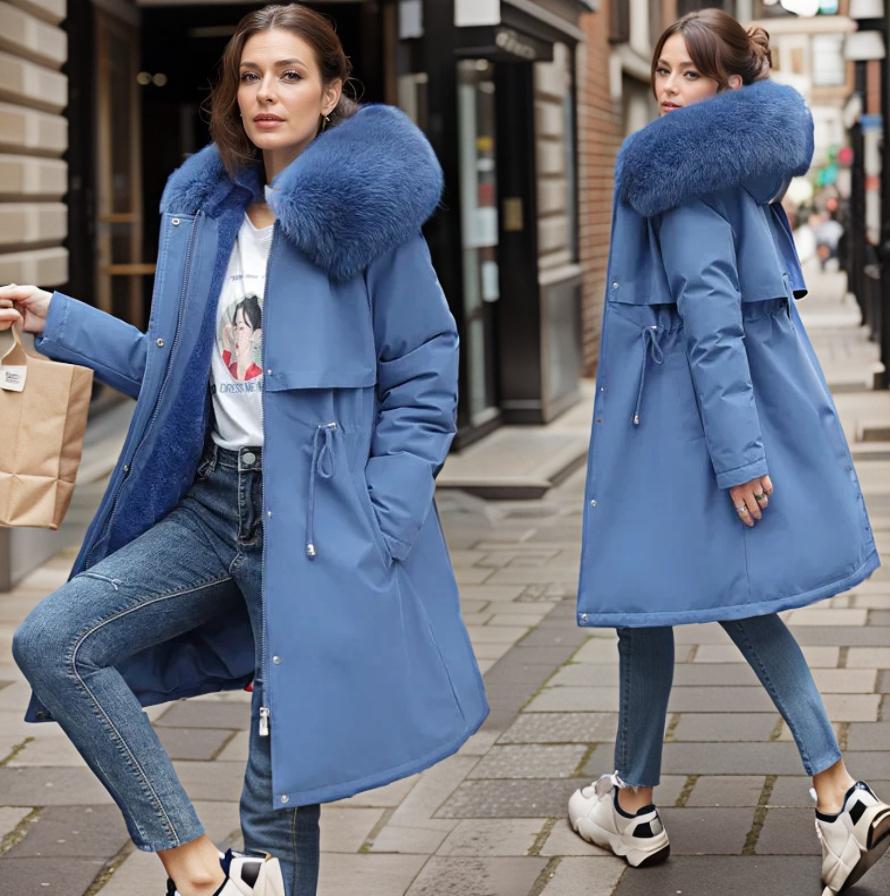 Women's warm waterproof winter coat, modern fit, sleek design, with hood and adjustable cuffs for wet conditions.