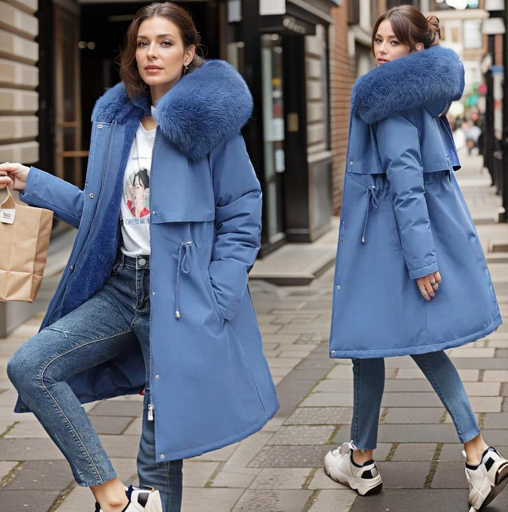 Women's warm waterproof winter coat, modern fit, sleek design, with hood and adjustable cuffs for wet conditions.