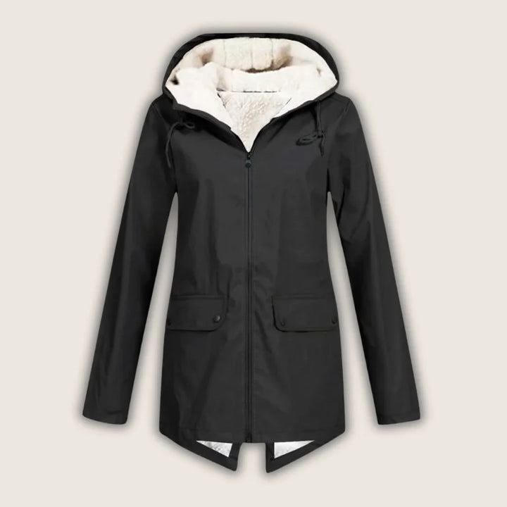 Everyday women's hooded jacket. Practical waterproof outerwear with front pockets, perfect for versatile rain protection.