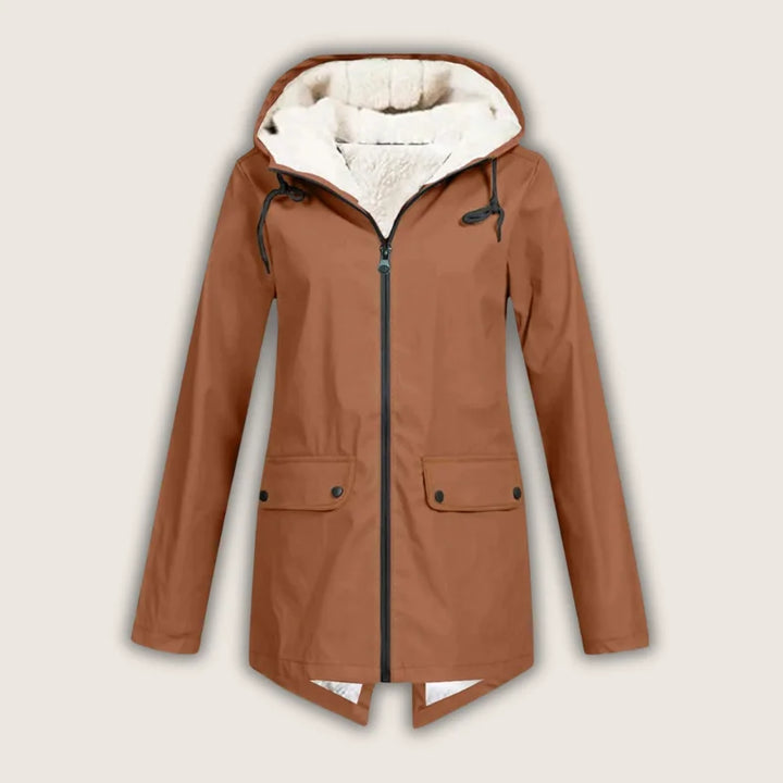 Stylish women's hooded waterproof jacket with front pockets. Weather-resistant outdoor outerwear for comfortable rain protection.