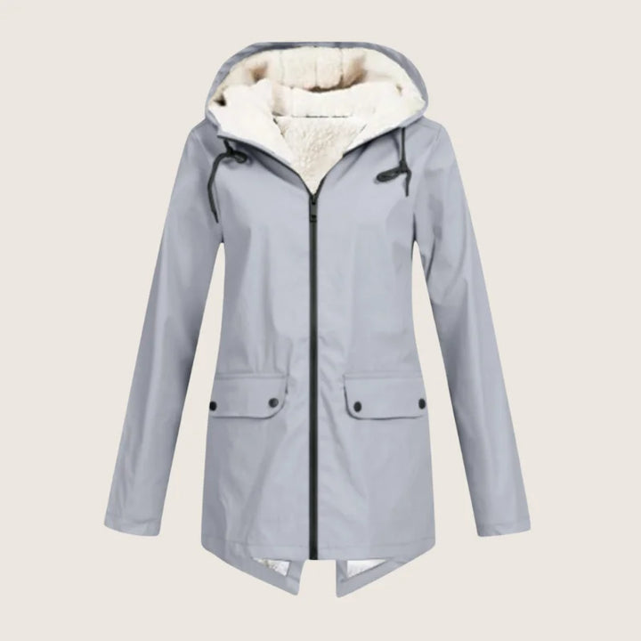 Stylish women's weather-resistant jacket. Hooded, waterproof, and comfortable outerwear with front pockets for women.