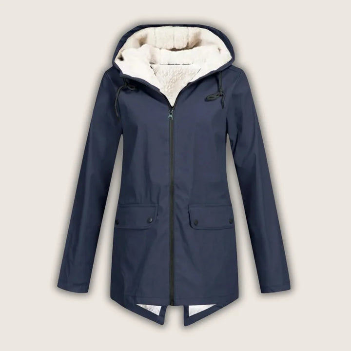 Versatile women's waterproof jacket. Hooded for rain, with practical front pockets for everyday and outdoor wear.