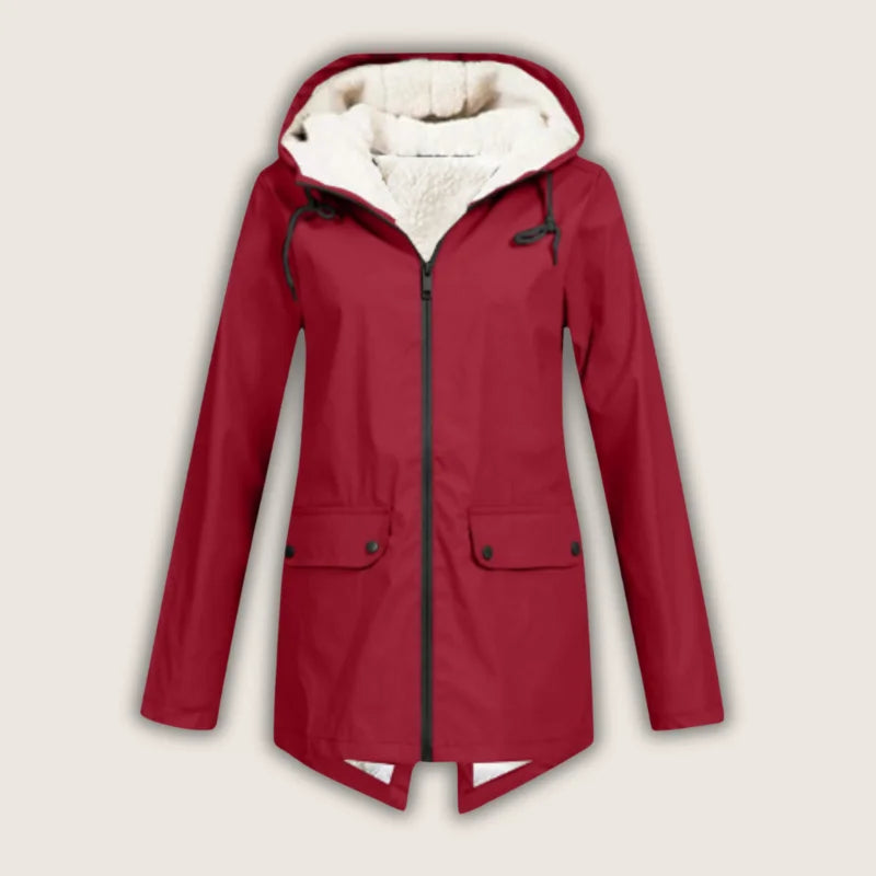 Women's waterproof hooded jacket for rain protection. Stylish and comfortable outdoor outerwear with front pockets.