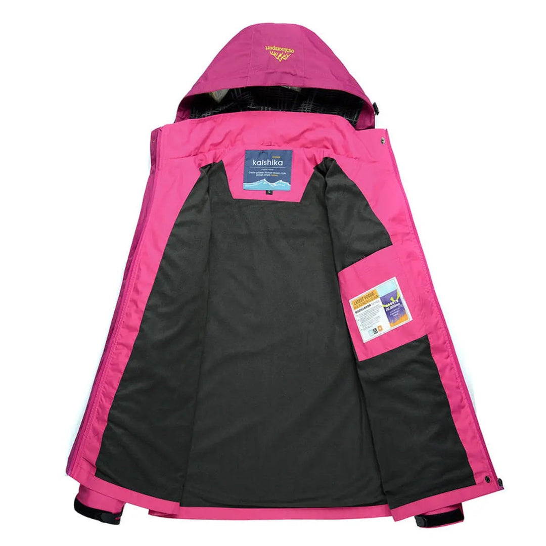 Quilted women's hooded jacket, waterproof & active, ideal for outdoor hiking. Features a stylish color block design.