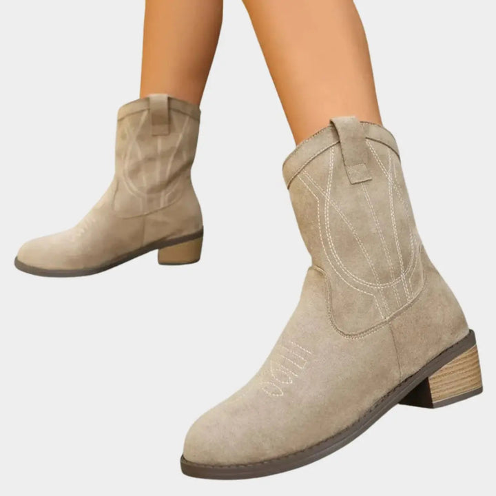 Fashionable women's cowboy ankle boots, perfect for festivals, with classic Western details & sturdy heel.