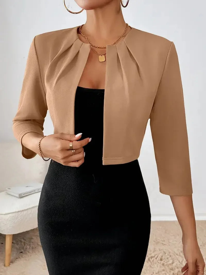 Stylish cropped blazer with delicate pleats, great for office or casual fashion.