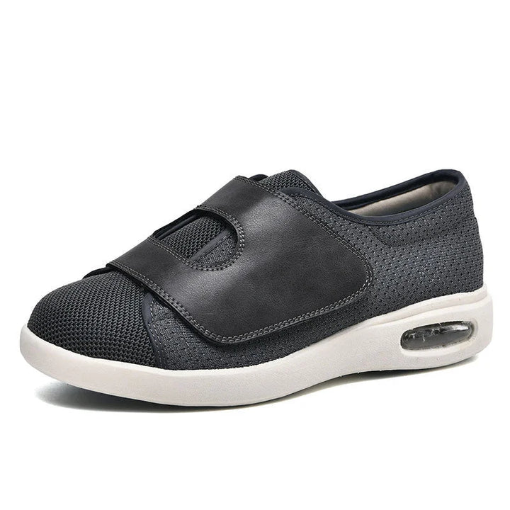 Slip-on women's wide fit walking sneakers with velcro strap & air cushion for everyday comfort.