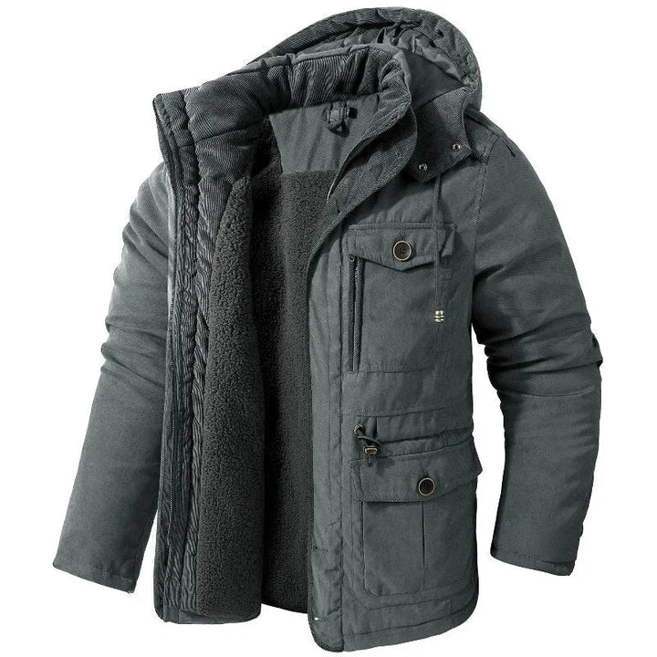 Stylish women's waterproof field jacket with multiple pockets & detachable hood, perfect for practical cold weather outdoor wear.
