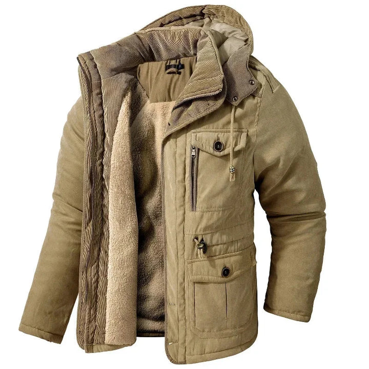 Women's durable winter utility field jacket with detachable hood, offering warmth and weather protection for cold outdoor activities.