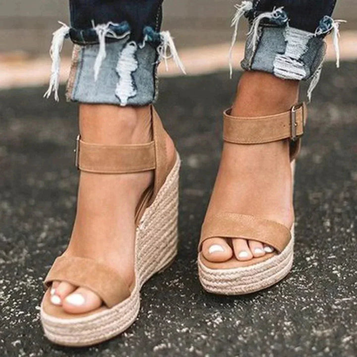 Elegant women's open-toe wedge sandals with ankle strap, ideal for comfortable summer chic footwear & ladies' casual style.