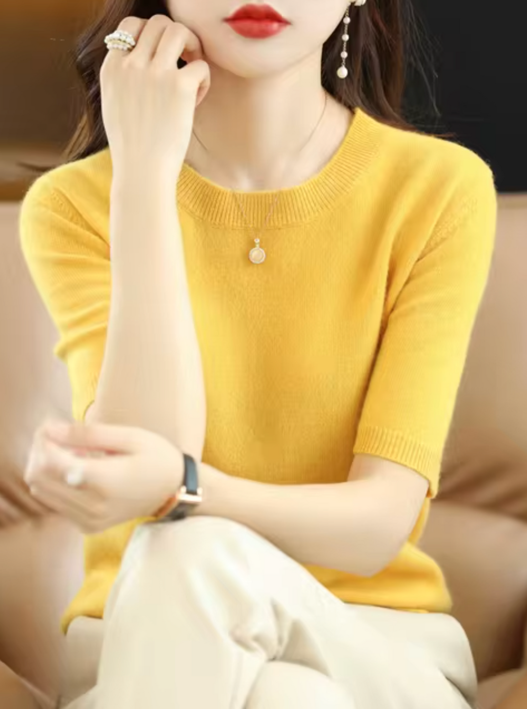 Elegant women's knit sweater. Short-sleeved, slim-fit top for versatile everyday chic fashion.