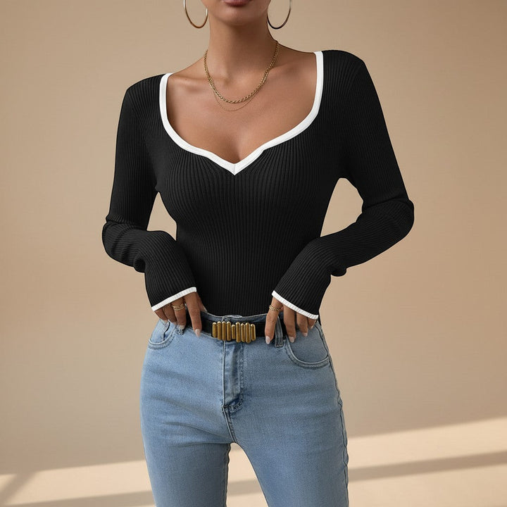 Women's ribbed long sleeve V-neck top with stylish contrast trim. Perfect for versatile everyday fashion.