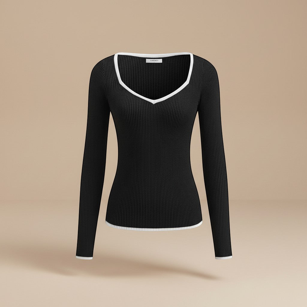 Modern women's ribbed V-neck full sleeve top with a fashionable contrasting trim, great for spring & fall.