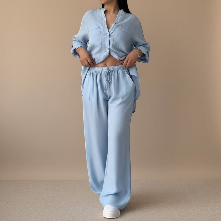 Effortless women's two-piece set with relaxed button-down shirt & wide-leg pants. Lounge & casual.