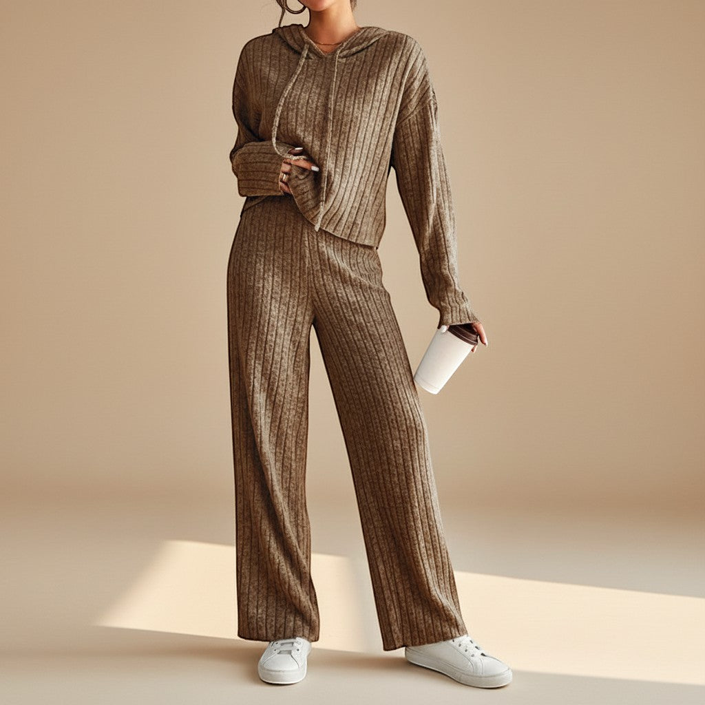 Stylish women's ribbed loungewear set including a cozy hoodie and comfortable straight-leg pants for versatile casual wear.