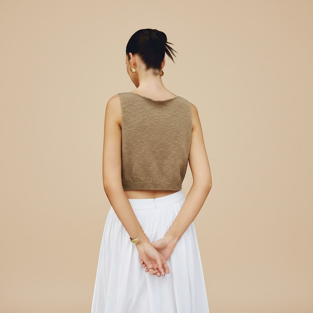 Versatile women's high neck sleeveless top, cropped for summer fashion and casual styling.