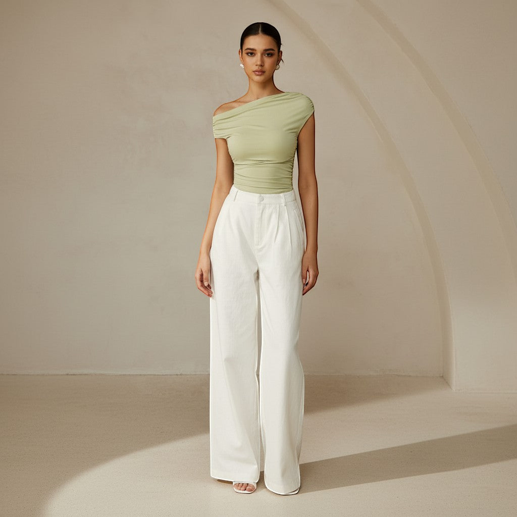 Fitted women's ruched top with a chic one shoulder, asymmetrical design for a modern look.