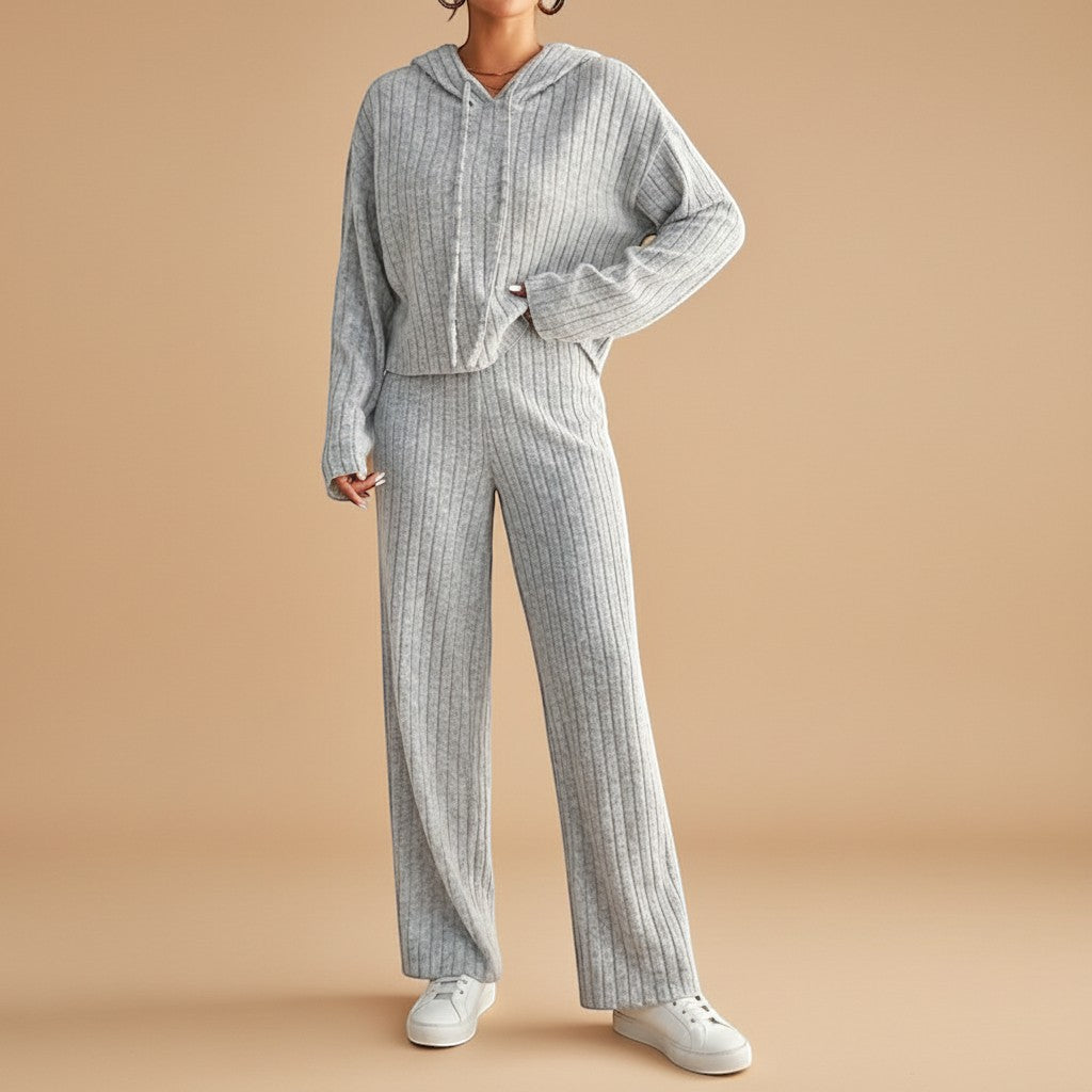 Cozy women's ribbed loungewear set with a soft hoodie and relaxed pants, ideal for comfortable home or athleisure wear.