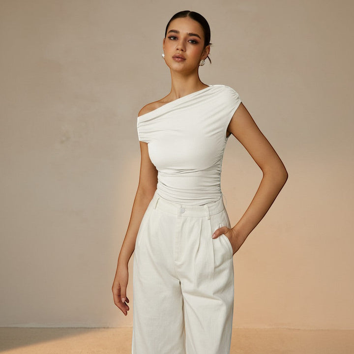 Elegant women's asymmetrical ruched top, one-shoulder design ideal for evening or party wear.