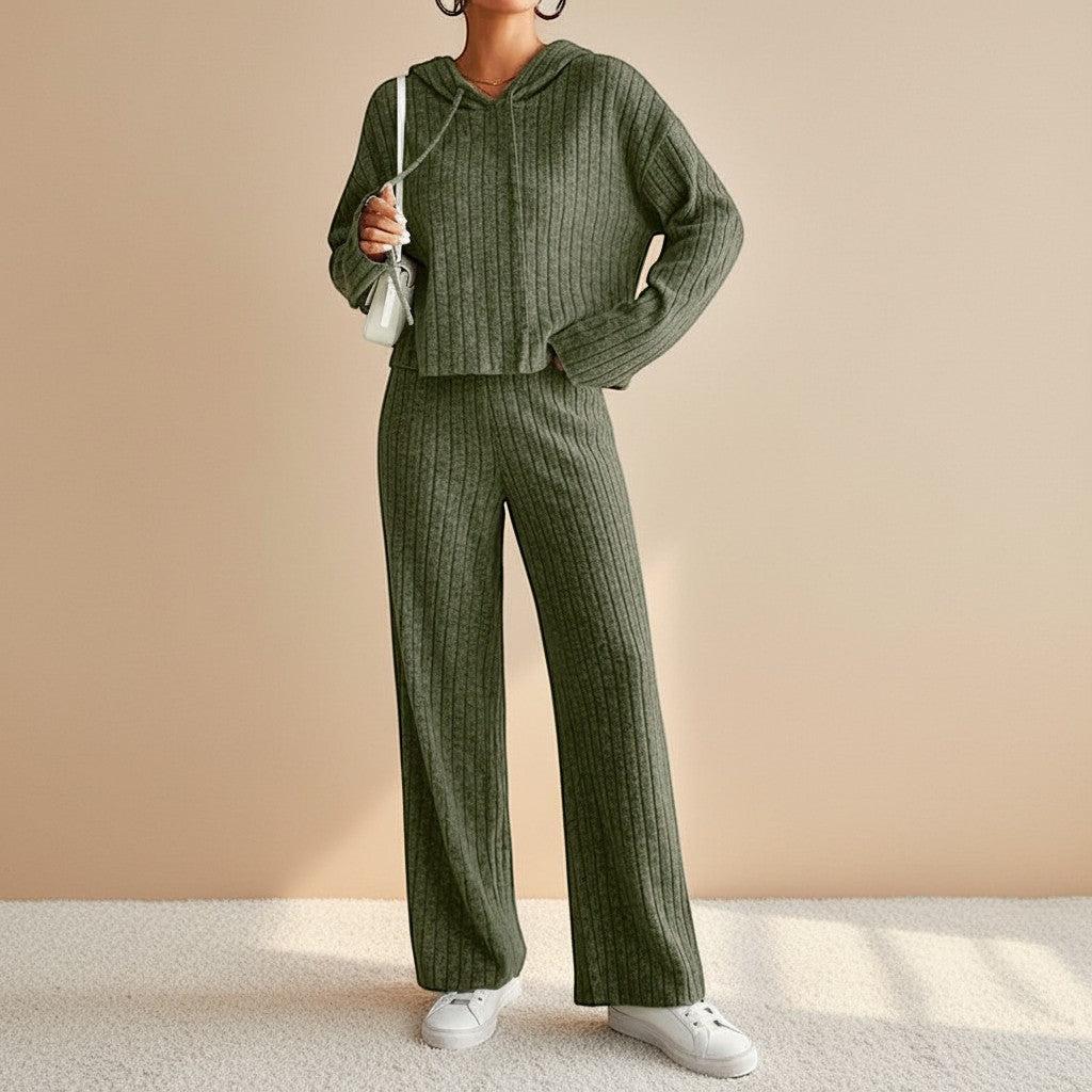 Comfortable women's ribbed two-piece set featuring a soft hoodie and relaxed straight-leg pants, perfect for travel.